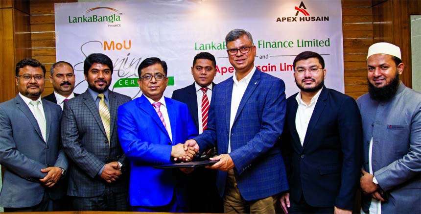 Khurshed Alam, Head of Retail Finance of LankaBangla Finance Limited (LBFL) and Moazzem Husain, Managing Director of Apex Husain Limited, exchanging an MOU signing documents at LBFL head office in the city recently. Under the deal, card members of LBFL wi