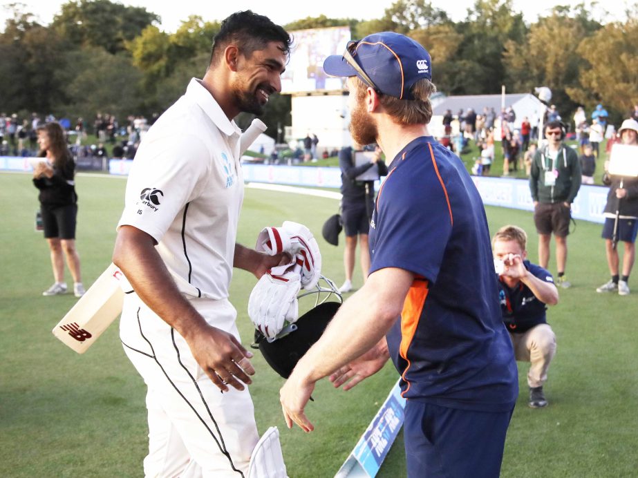 New Zealand's Ish Sodhi is greeted by his captain Kane Williamson (right) as he leaves the field at the end of play on the final day of the second cricket test against England at Hagley Oval in Christchurch, New Zealand onTuesday.