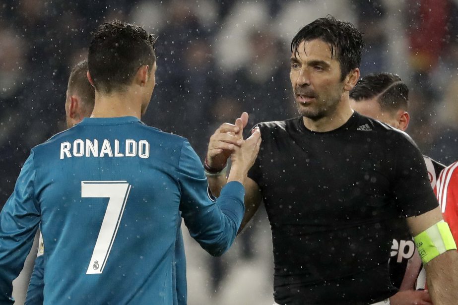 Juventus goalkeeper Gianluigi Buffon (right) shakes hands with Real Madrid's Cristiano Ronaldo after the Champions League round of 8 first-leg soccer match between Juventus and Real Madrid at the Allianz stadium in Turin, Italy on Tuesday. Real won 3-0.