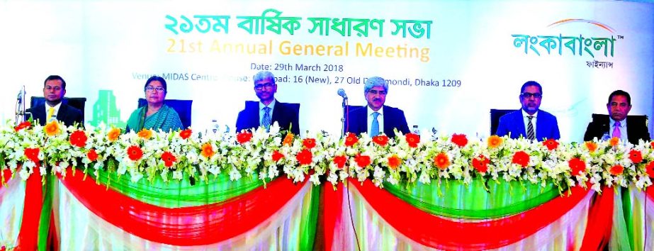 Mohammad A Moyeen, Chairman of LankaBangla Finance Limited, presiding over its 21st AGM at MIDAS Center in the city recently. The AGM approved 7.50 percent cash and 7.50 percent stock dividend. Mostafa Kamal FCA, Managing Director, Mahbubul Anam, IW Senan