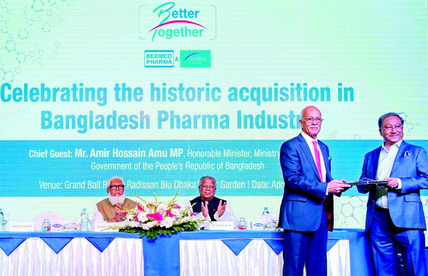 Nazmul Hassan Papon, Managing Director of Beximco Pharmaceuticals Limited and Akhter Matin Chaudhury, Managing Director of Nuvista Pharma Limited, exchanging a MoU signing documents at a hotel in the city on Monday. Industries Minister Amir Hossain Amu, S