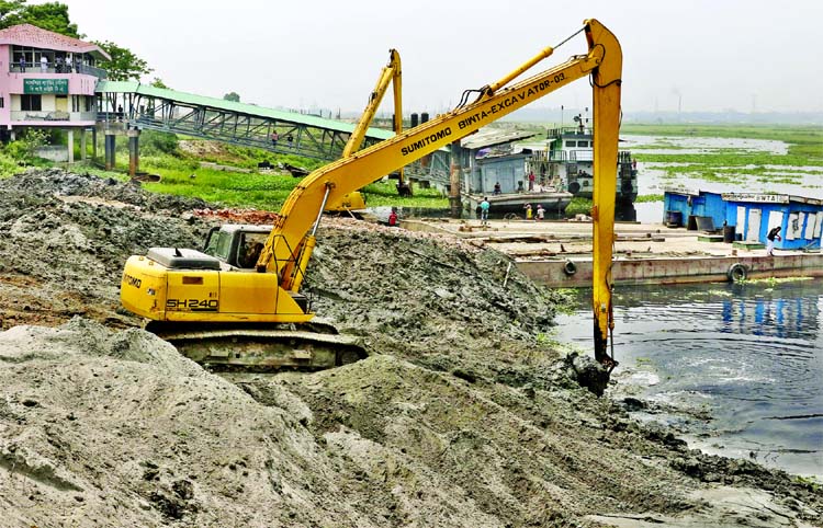 BIWTA on Friday recovered the bank of Turag by dismantling illegal establishments from different areas. This photo was taken from Ashulia area.