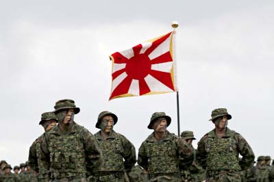 Soldiers of Japanese Ground Self-Defense Force (JGSDF)'s Amphibious Rapid Deployment Brigade, Japan's first marine unit since World War Two, gather at a ceremony activating the brigade at JGSDF's Camp Ainoura in Sasebo, on the southwest island of Kyush