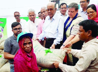 KURIGRAM: Food Minister Advocate Md Kamrul Islam MP inaugurating the fortified rice distribution programme among beneficiaries under Food-Friendly Programme at Kurigram Sadar Upazila Parishad premises as Chief Guest on Thursday.