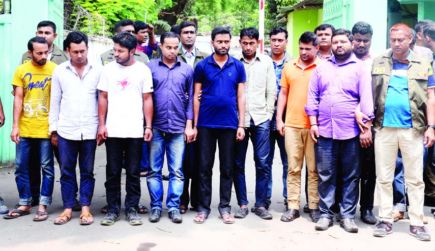 DB police arrested 10 young men from different areas and seized some electronic machines and devices of question leak from their possession. This photo was taken on Saturday.