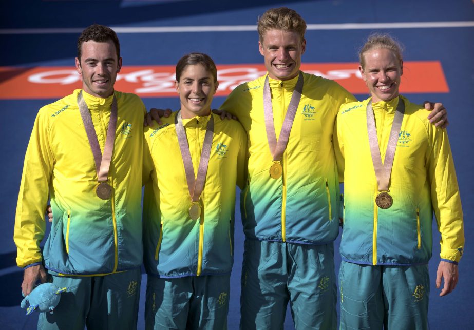 Australia's gold medal mixed relay triathlon team (from left) Jacob Birtwhistle, Ashleigh Gentle, Matthew Hauser, and Gillian Backhouse, stand with their medals at the Southport Broadwater Parklands during the 2018 Commonwealth Games on the Gold Coast, A