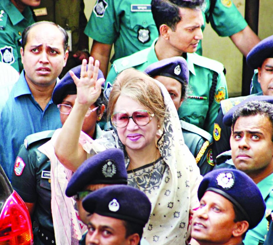 BNP Chairperson Begum Khaleda Zia waving to supporters while returning to prison at Nazimuddin Road after undergoing medical tests at BSMMU on Saturday.