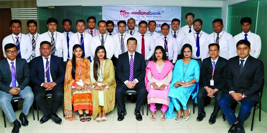Md. Ahsan-uz Zaman, Managing Director of Midland Bank Limited, poses with the participants of a 5-day long Foundation Training Programme for its officials at the banks training institute in the city recently. Officials from branches and head office of the