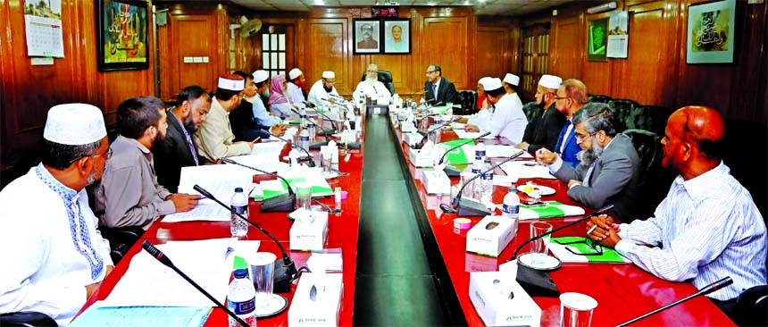 Sheikh Moulana Mohammad Qutubuddin, Chairman, Shariah Supervisory Committee of Islami Bank Bangladesh Limited, presiding over a meeting at the banks head office in the city recently. Md. Mahbub ul Alam, Managing Director of the bank, Dr. Mohammad Abdus Sa