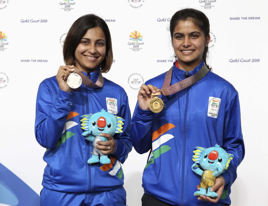 Manu Bhaker of India (right) poses with the gold medal, along with silver medalist Sidhu Heena of India during the women's 10m Air Pistol final at the Belmont Shooting Centre during the 2018 Commonwealth Games in Brisbane, Australia on Sunday.