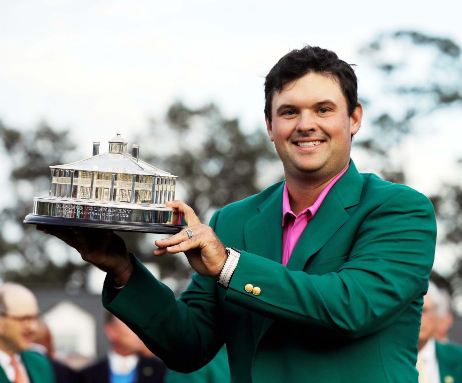 Patrick Reed holds the championship trophy after winning the Masters golf tournament in Augusta, Ga.on Sunday.