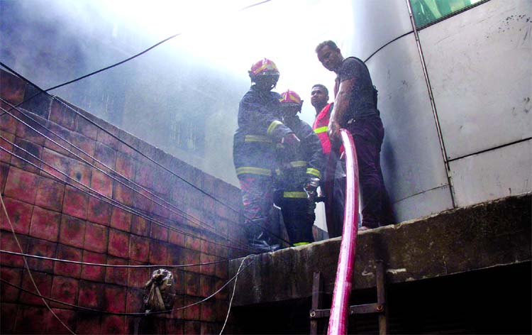 Firefighters struggling to douse the flame as fire breaks out at a building in city's Kakrail area on Monday.