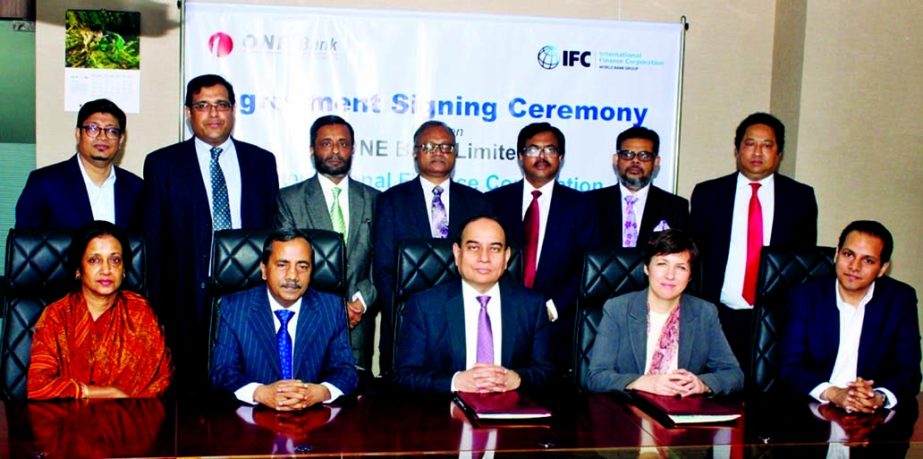M. Fakhrul Alam, Managing Director of ONE Bank Limited and Wendy Werner, Country Manager of IFC Bangladesh, poses for a photograph after signing an agreement for the support and funding of International Trade Program through the bank's offshore banking u