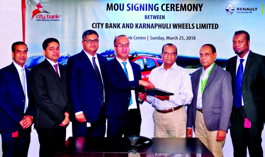 Mashrur Arefin, AMD of City Bank Limited and Arun Kumar Sarkar, Resident Director of Karnaphuli Wheels Limited (sole distributor of brand new Renault cars in Bangladesh), exchanging an agreement signing documents at the bankâ€™s head office in the ci