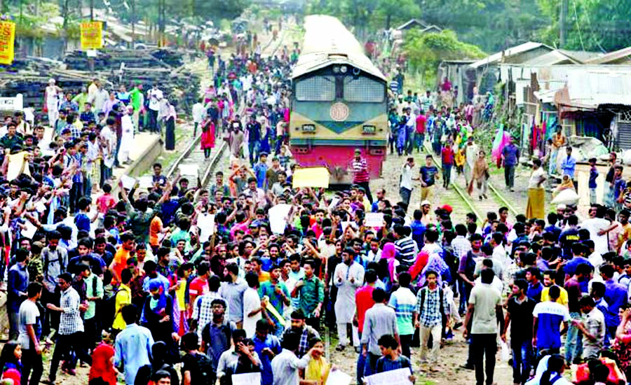 Agitating students blockade railway at Sholoshahar area in Chattogram on Wednesday demanding reformation of existing quota system.