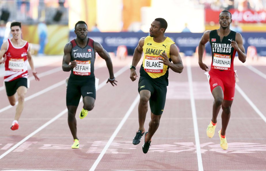 FILE - In this Sunday, April 8, 2018 file photo, Jamaica's Yohan Blake (second right) runs to win his heat in the men's 100m at the Carrara Stadium during the 2018 Commonwealth Games on the Gold Coast, Australia.