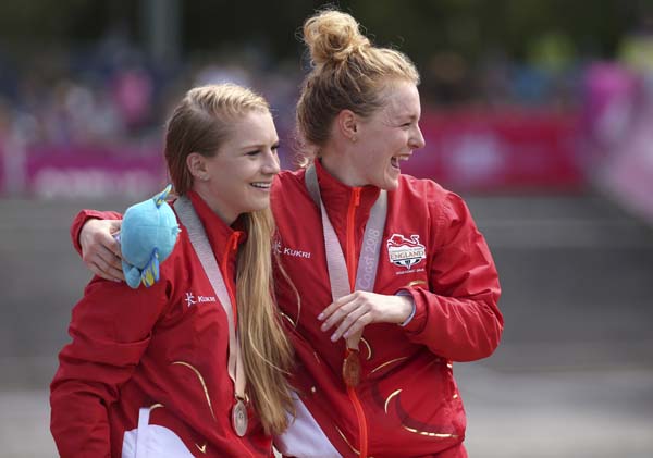England's Annie Last (right) celebrates with countrywoman Evie Richards after they received the gold and silver medals respectively, during the women's cross-country race at the Nerrang mountain bike trails during the 2018 Commonwealth Games on the Gold