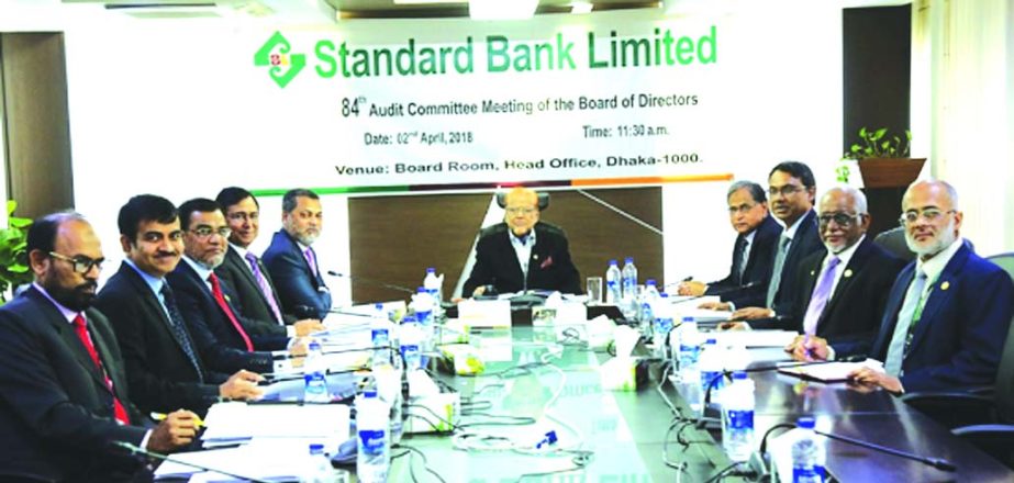 SS Nizamuddin Ahmed, Chairman of the Audit Committee of the Board of Directors of Standard Bank Limited, presiding over its 84th meeting at the bank's head office in the city recently. Mamun-Ur-Rashid, Managing Director and other members of the committee
