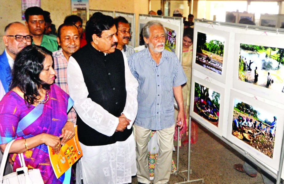 Shipping Minister Shajahan Khan visits the pictures which were placed at the inaugural day of Rupashi Bangla Photo Competition organised by Bangladesh Photojournalists Association at the Jatiya Press Club on Friday.