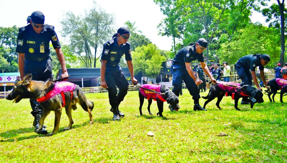 Law enforcers scanning the ground of Ramna Park area with dog squad to beef up security measures on the eve of Pahela Baishakh, the first day of Bangla New Year-1425. The snap was taken on Friday.