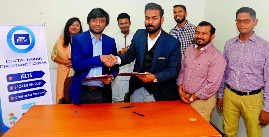 Saad Solaiman, Director, Business Development of Effective English Develpoment Program (EEDP) and Adnan Javed, CEO of Career Solutions Bangladesh (CSB) exchanging an MoU signing documents to work in a mutually beneficial partnership through two way client