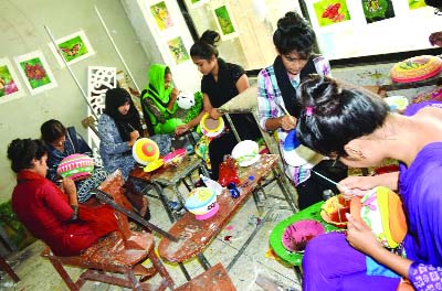 KHULNA UNIVERSITY: Students of Fine Arts Institute are busy in taking preparations ahead of Pahela Baishakh. This picture was taken yesterday.