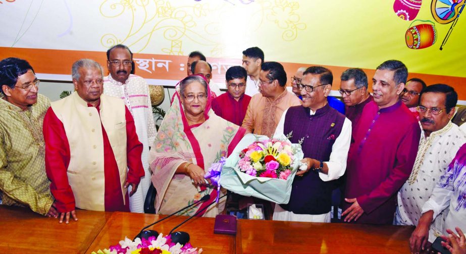 Prime Minister Sheikh Hasina exchanging greetings with leaders of Bangladesh Awami League at Ganobhaban on Pahela Baishakh on Saturday.