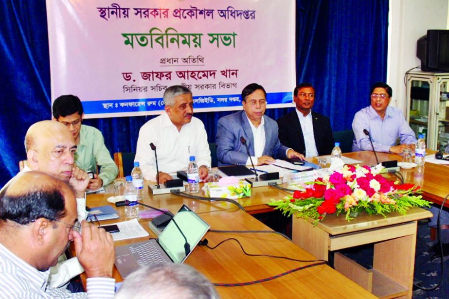 Senior Secretary of the Local Government Division Dr Zafar Ahmed Khan along with other distinguished persons at a views exchange meeting in the conference room of LGED in the city on Monday.