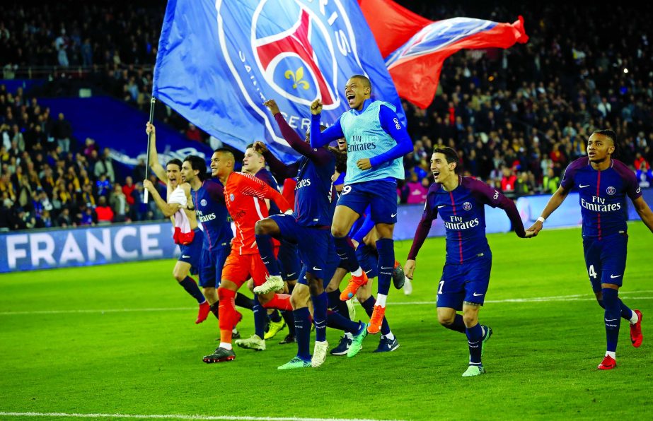 PSG players celebrate at the end of the French League One soccer match between Paris Saint Germain and Monaco at the Parc des Princes Stadium in Paris on Sunday. PSG won 7-1.