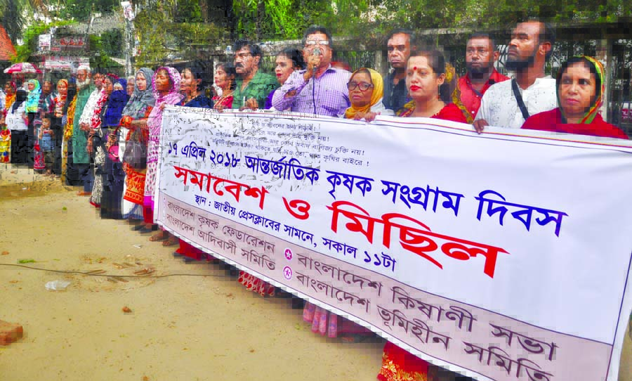 Different organisations including Bangladesh Krishak Federation organised a rally in front of the Jatiya Press Club on Tuesday marking International Peasants Movement Day.
