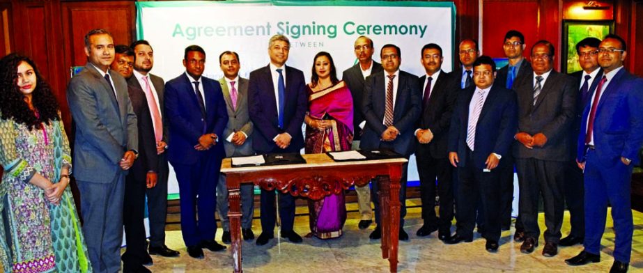 Adeeba Rahman, CEO of Delta Life Insurance Company Limited (DLICL) and Apurva Jain, Managing Director of Head of Transaction Banking of Standard Chartered Bank (SCB), poses for a photograph after signing an agreement at DLICL head office in the city recen