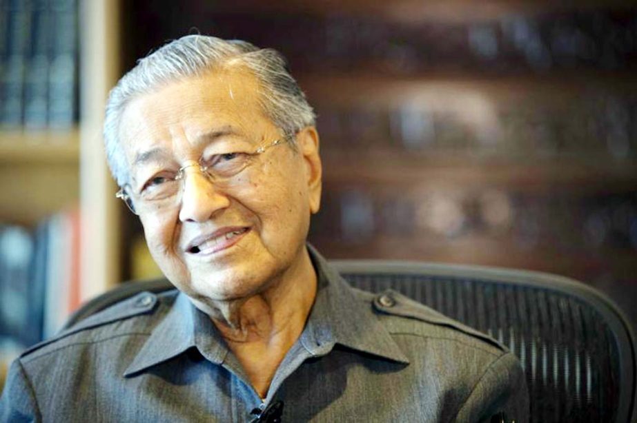 Former Malaysian strongman Mahathir Mohamad smiles during an interview with Associated Press at his office in Putrajaya, Malaysia on Wednesday.