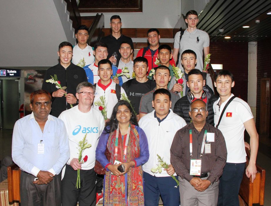 Officials of Bangladesh Volleyball team receiving Kyrgyzstan Volleyball team with bouquet at the Hazrat Shahjalal International Airport on Wednesday.