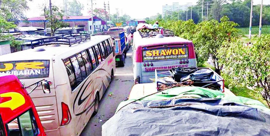 Hundreds of vehicles got stuck in a huge tailback from Gazipur-Chandra to Savar on Baibail Road, causing sufferings to commuters for several hours on Thursday.