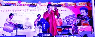 BANARIPARA (Barishal) : Reputed singer Nokul Kumar Biswas rendering songs at the cultural function of Syedkathi SESDP High School on the occasion of Pahela Baishaikh recently.