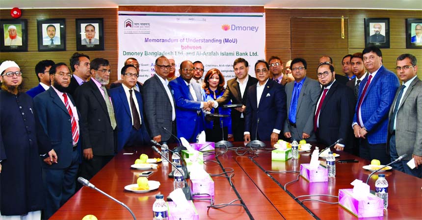 Md Habibur Rahman, Managing Director of Al-Arafah Islami Bank Limited and Aref R Bashir, Managing Director of D-Money Bangladesh Limited, exchangning an MoU signing documents on 'Digital Islami Walet' at the banks head office in the city recently. Abdus