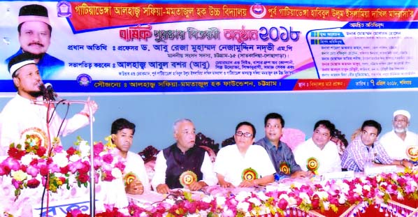 The prize distribution ceremony of Gatiadanga Alhaj Safia Mamtazul Hoque High School was held recently. Local legislator Prof Abu Reza Md Nizamuddin Nadvi MP seen addressing the function as Chief Guest.