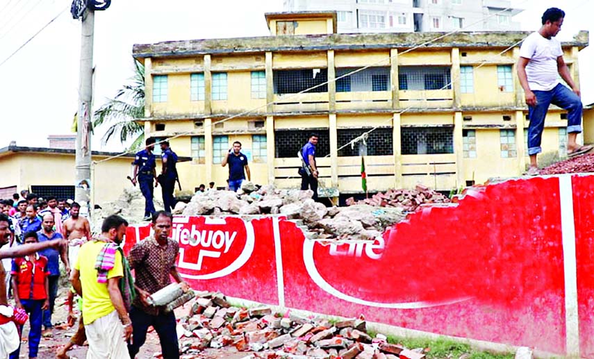 A student was killed and three others seriously injured as under construction wall of a school collapsed on them at Shibrampur in Pabna on Saturday.