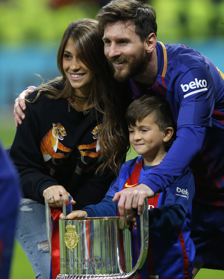 Barcelona's Lionel Messi poses for a photo during an award ceremony after defeating Sevilla 5-0 in the Copa del Rey final soccer match at the Wanda Metropolitano stadium in Madrid, Spain on Saturday.