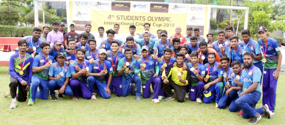 Players and high officials of Students Olympic Indian National Cricket Team (Under 21) and Daffodil International University Cricket Team pose for a photograph at the Daffodil International University permanent Campus cricket ground on Monday.