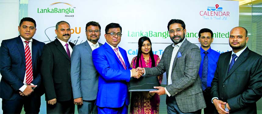 Khurshed Alam, Head of Retail Finance of LankaBangla Finance Ltd (LBF) and Md. Shahriar Zaman, Managing Director of Calendar Tours and Travel Limited, exchanging an MOU signing documents at LBF office in the city recently. Under the deal, LBF card member
