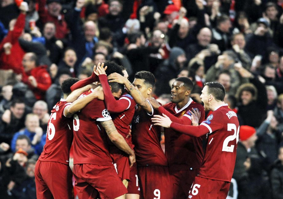 Liverpool's Mohamed Salah celebrates with teammates after scoring his side's opening goal during the Champions League semifinal, first leg, soccer match between Liverpool and Roma at Anfield Stadium in Liverpool, England on Tuesday.