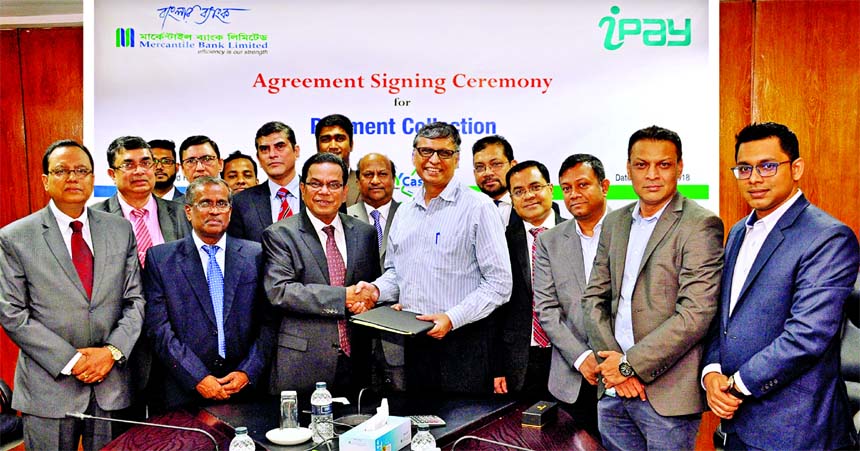 Kazi Masihur Rahman, Managing Director and CEO of Mercantile Bank Limited and Zakaria Swapan, Founder & CEO of iPay Systems Limited, exchanging documents after signing a deal for utility services payment system through Mobile Banking without any charge at