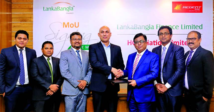 Khurshed Alam, Head of Retail Finance of Lanka Bangla Finance Ltd and Sohail Majid, Director, Marketing and Sales of Regent Airways sign an MoU at an office on Monday. Under this deal, the card member of the finance company will enjoy EMI facility up to 6