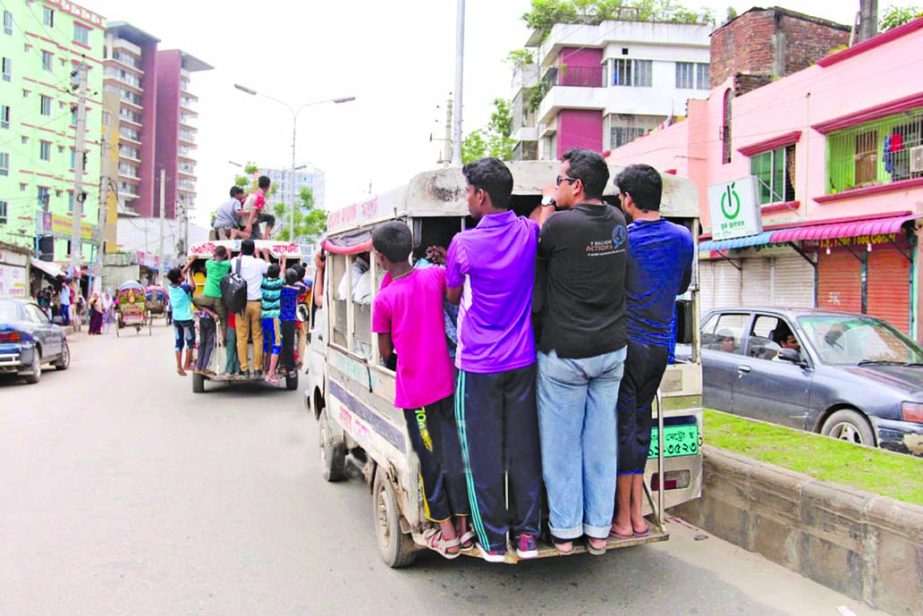 Home-going people availing the â€˜Leguna serviceâ€™ taking risk of life despite frequent accidents on city roads. This photo was taken from Mohakhali area on Wednesday.