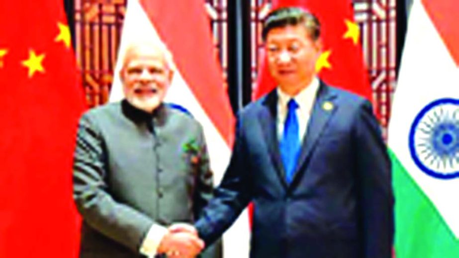 Indian Prime Minister Narendra Modi shaking hands with Chinese President Xi Jinping as he welcomes him at a hotel in Ahmadabad, India.