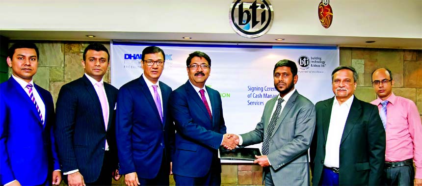 Md. Ziaur Rahman, Head of Corporate Banking Division of Dhaka Bank Limited and Kazi Saiful Hoque, General Manager (Finance) of Building Technology & Ideas Limited, exchanging an agreement signing documents at the developer company head office in the city