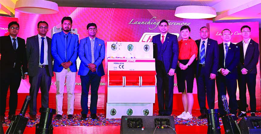 R N Paul, Managing Director of RFL Group, inaugurating a product of RFL Electronics Limited (a sister concern of RFL Group) at a convention hall in the city on Wednesday. Engineer Mir Hasan Sarwar Kabir, Head of Business, Gloria Cai, Senior Manager, (Mark