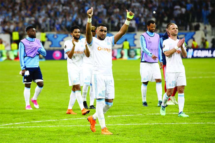 Marseille's Dimitri Payet celebrates with team mates after the Europa League semifinal first leg soccer match between Olympique Marseille and RB Salzburg at the Velodrome stadium in Marseille, France on Thursday.