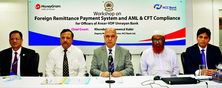 Khondoker Nayeemul Kabir, DMD of NCC Bank Limited, presiding over a day-long workshop on "Foreign Remittance Payment System and AML & CFT Compliance" for officers of Ansar-VDP Unnayan Bank at the bank Training Institute in the city on Sunday as chief g